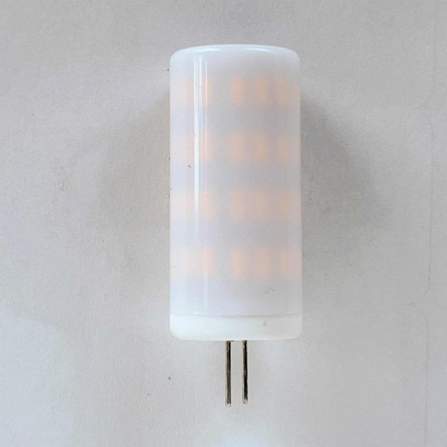 White Artschatz LED light bulb replacement with cylindrical frosted cover and two metal pins. - LED Light Bulb replacement 1W, 2W, 3W