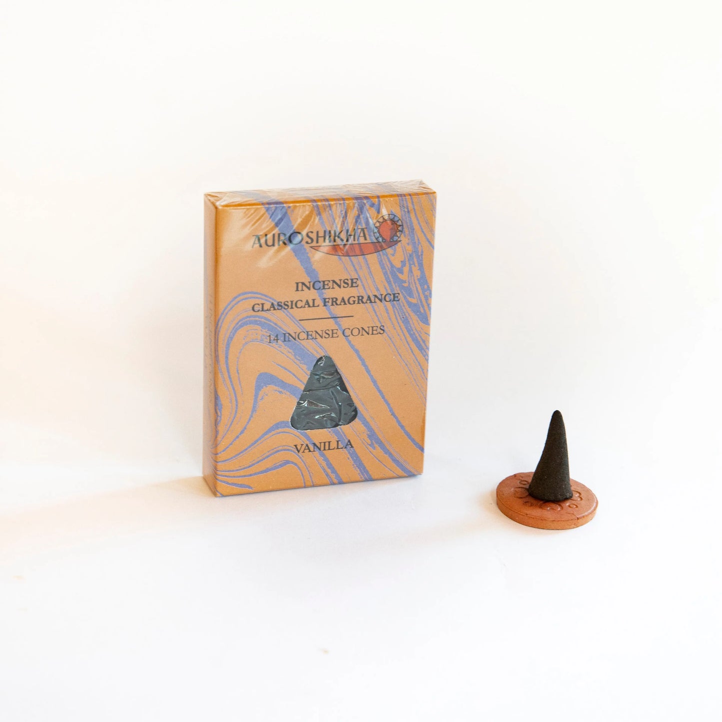 Artschatz Vanilla incense cones with marbled orange-blue packaging and single black cone on terracotta holder. - Vanilla