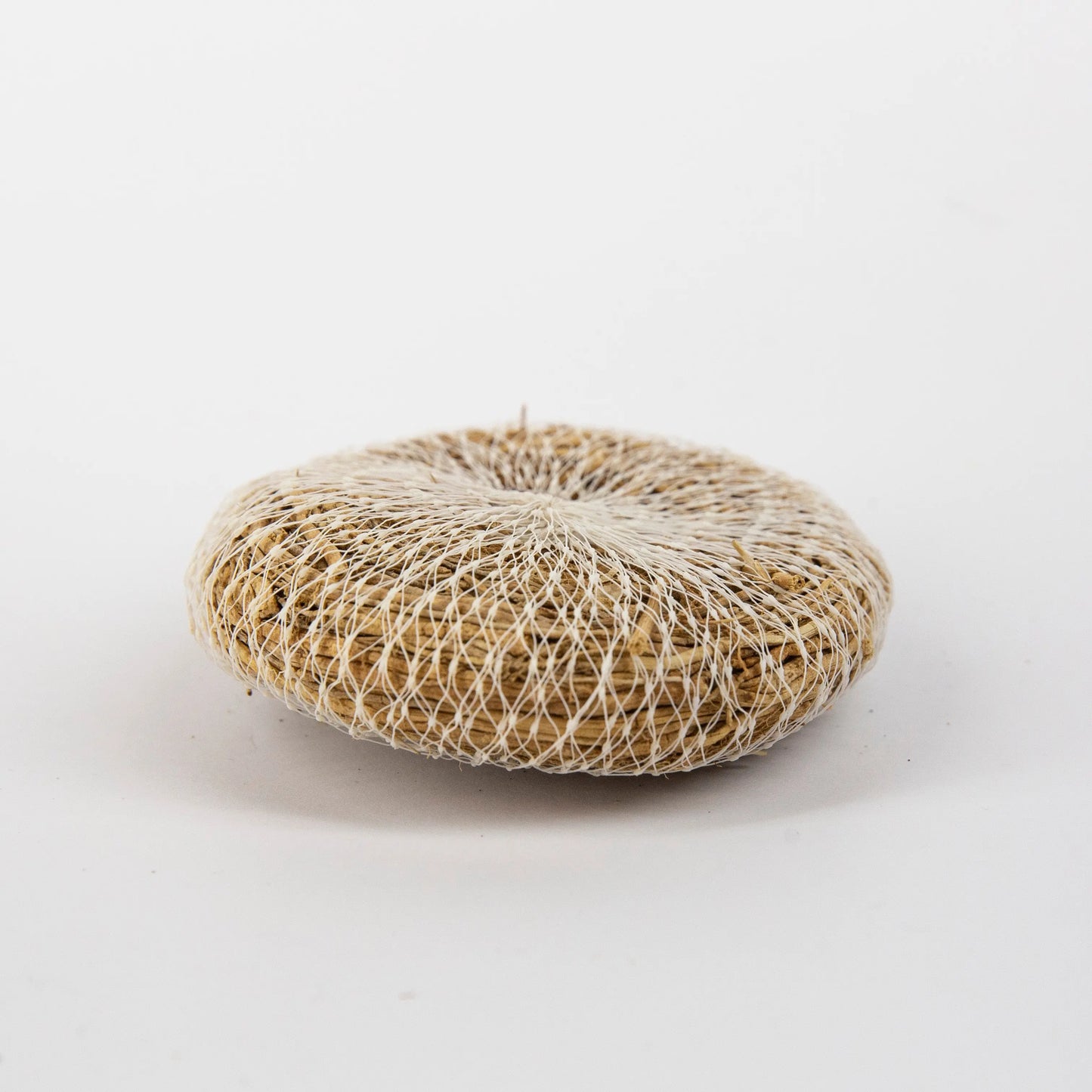 Round natural vetiver root bath scrub wrapped in white netting with Artschatz branding. - Auroshikha Vetiver Root Bath Scrub