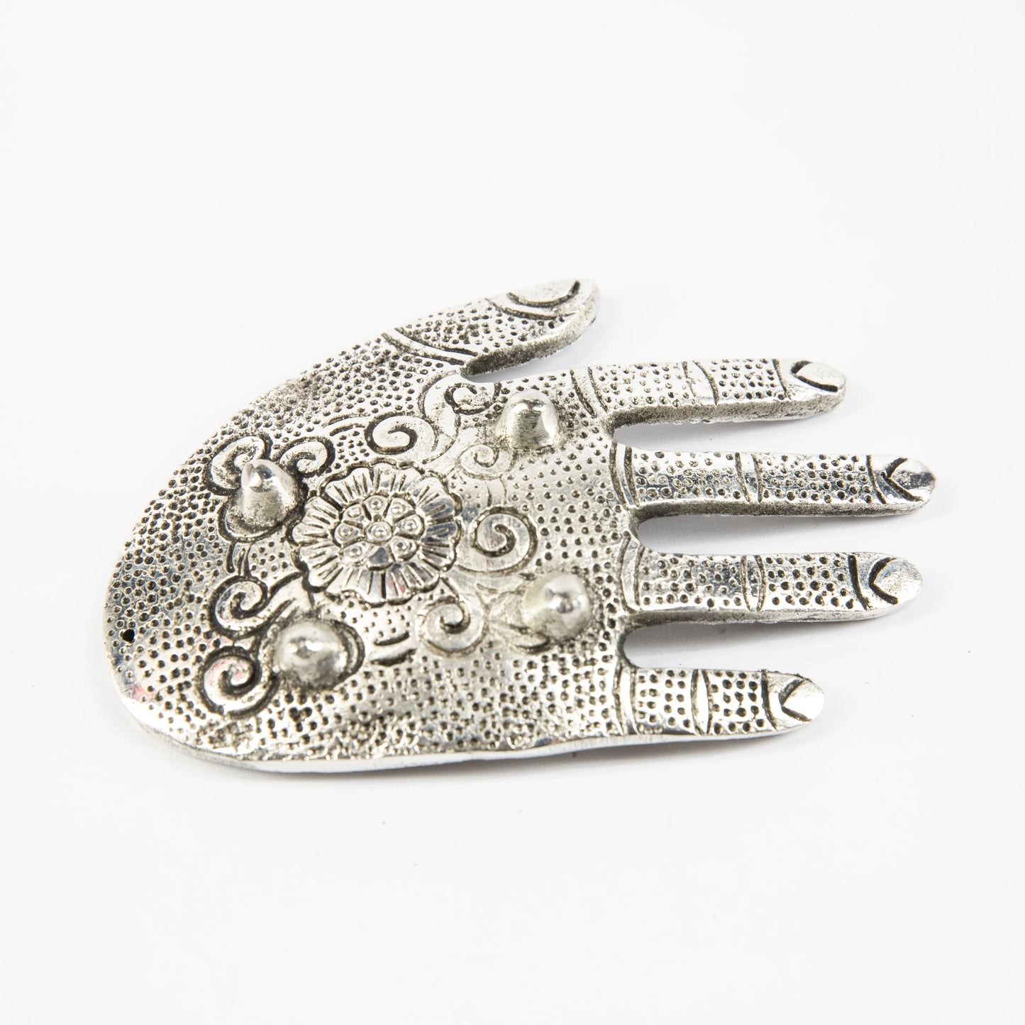 Silver Artschatz hand-shaped incense holder with intricate floral and dot patterns. - Silver Hand Incense Holder