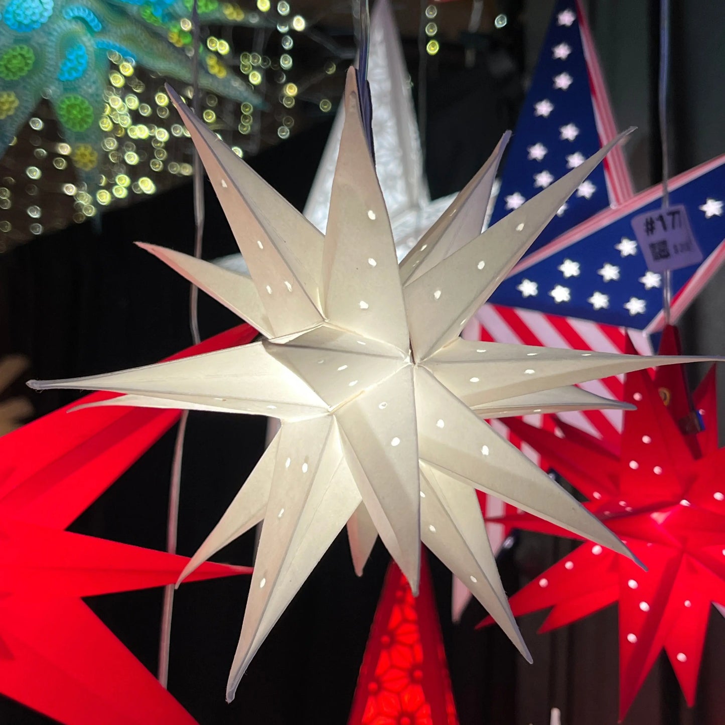 Moravian Mini Star white needle punch 7-inch paper star light by Artschatz – intricate punched pattern.