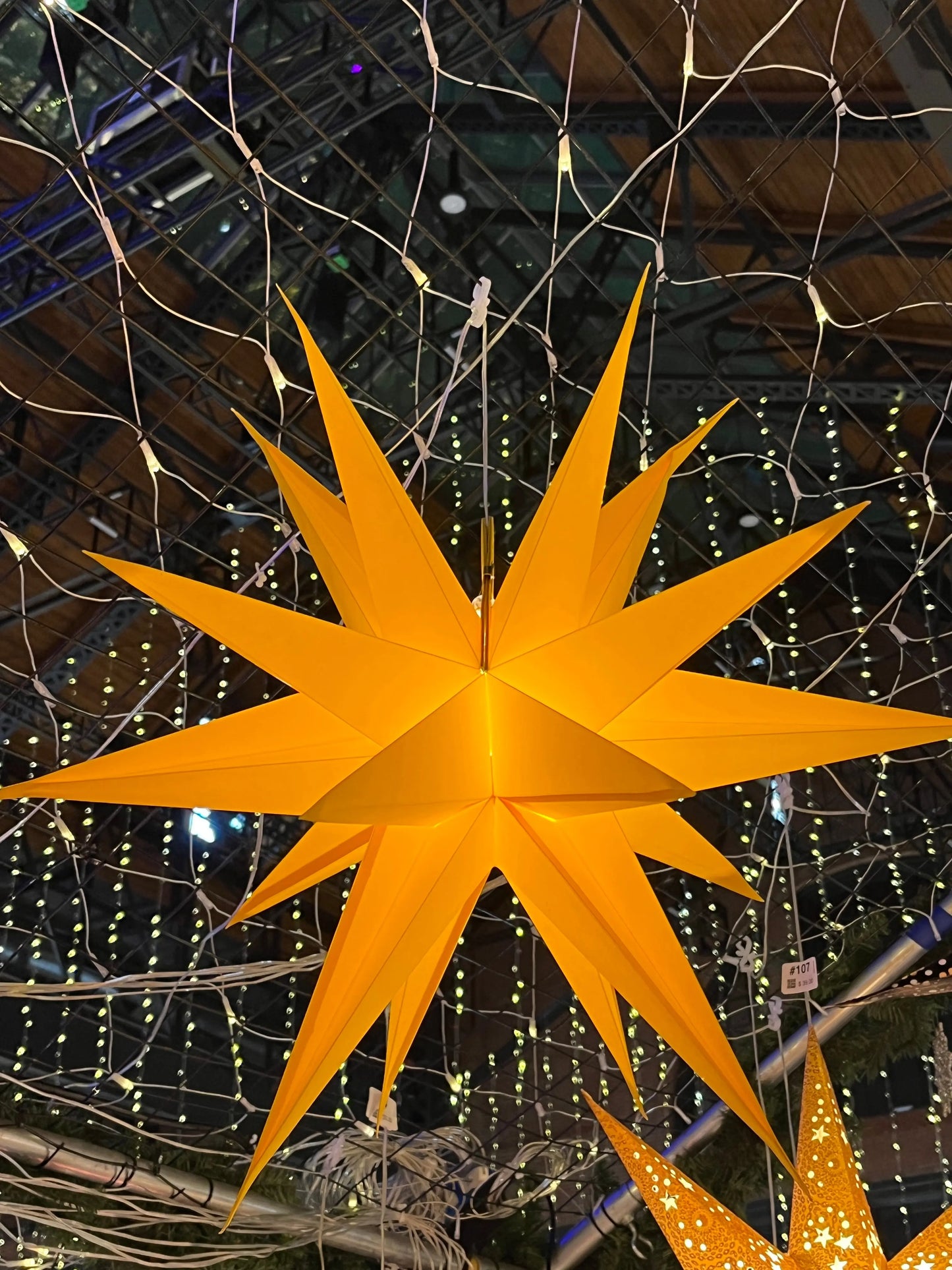 Moravian Star yellow 24-inch paper star light by Artschatz – traditional Moravian form.