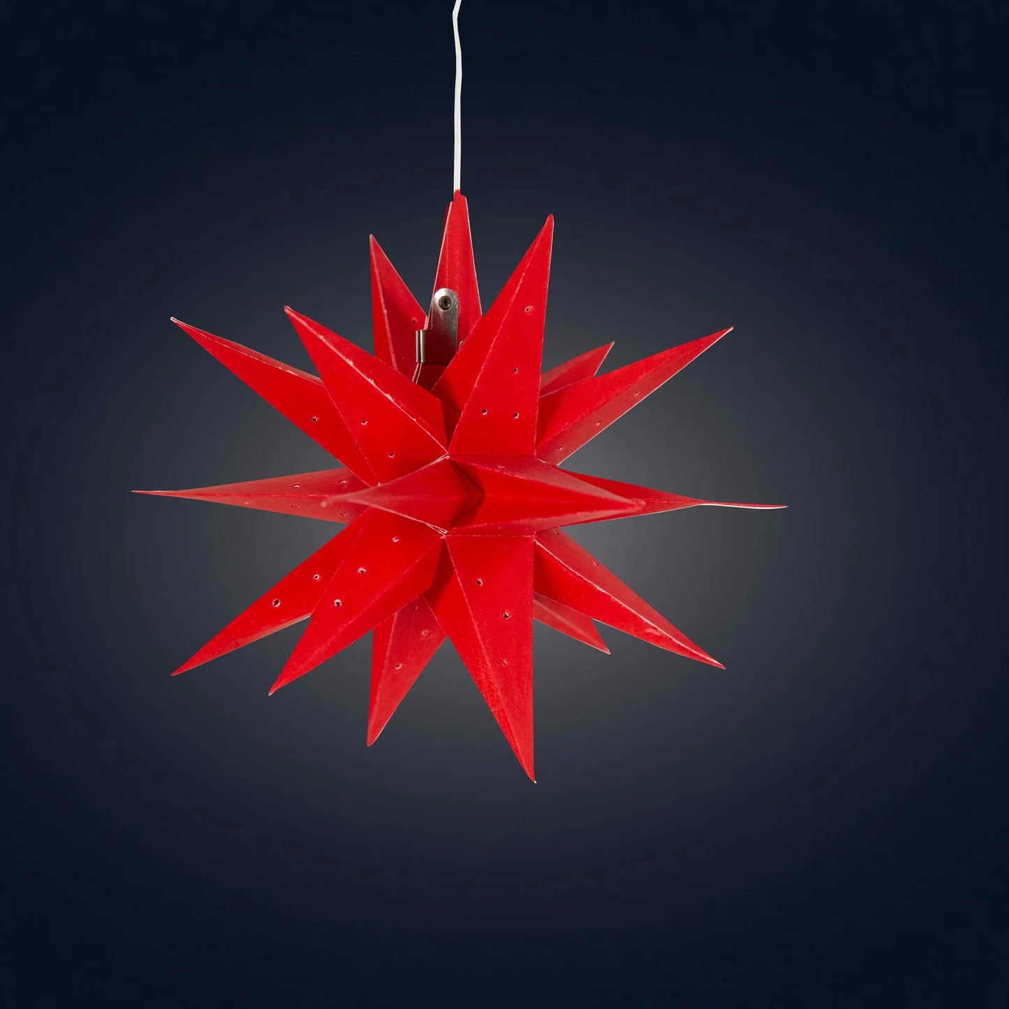 7" red Artschatz Moravian mini star with needle punch details hanging by white cord. - Moravian Mini Star 7" Red - Needle Punch