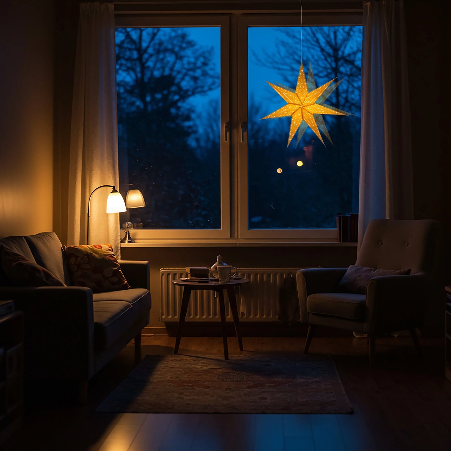 23-inch gold glitter 7-point paper star by Artschatz glowing in window at dusk. - Prima Dottie 7 Pointer 23 inch Gold Glitter
