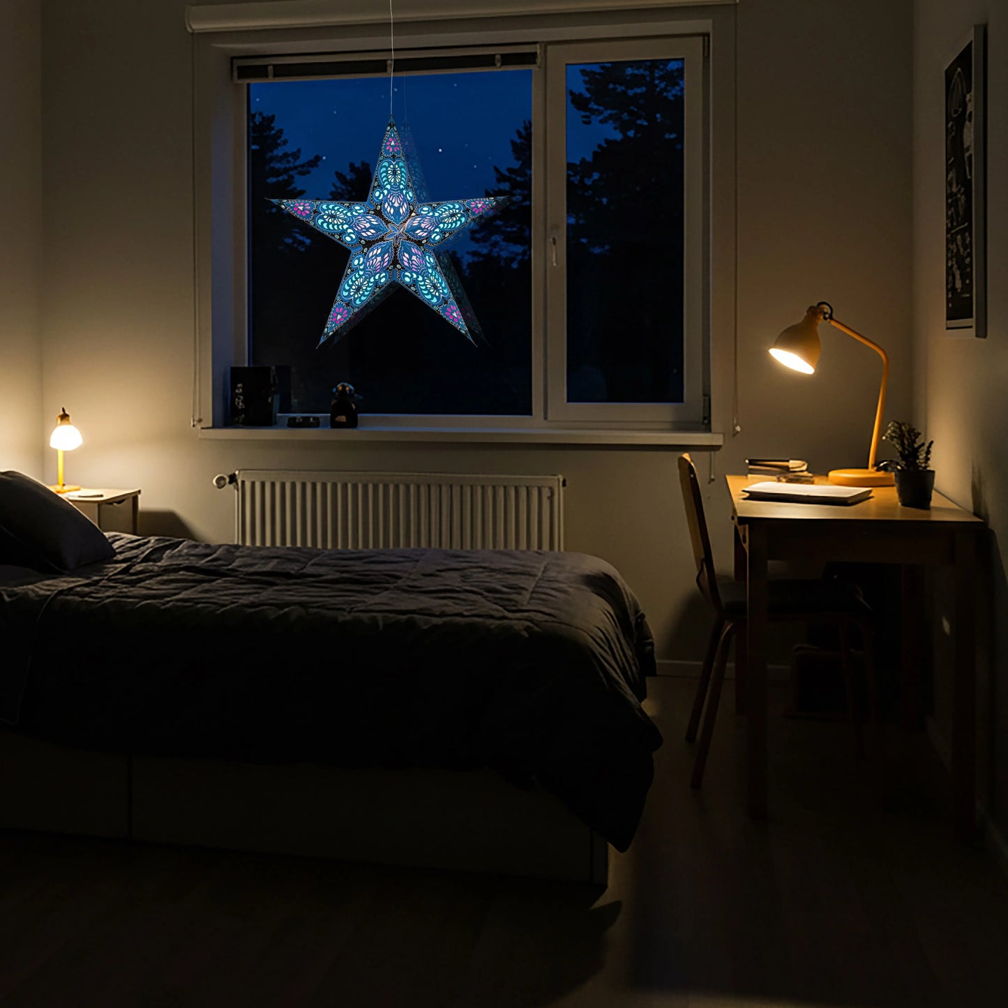 24-inch blue glitter Artschatz Phoenix 5-point paper star illuminated in window at night. - Phoenix 5 Pointer 24 inch Blue