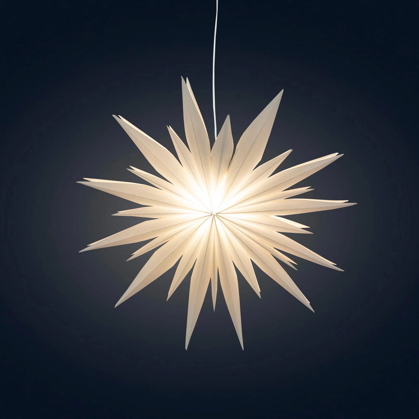 White paper Artschatz Snowflake Ice Star light with pointed starburst design hanging against dark background. - Snowflake Ice Star - 8, 12 or 16 inch