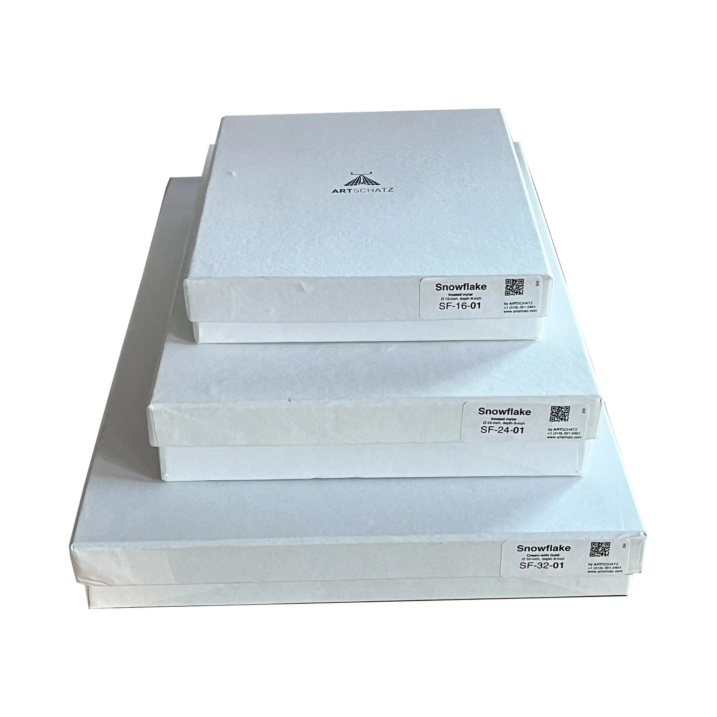 Stack of three white boxes labeled Snowflake 24 inch frosted mylar by Artschatz. - Snowflake -24 inch - frosted mylar