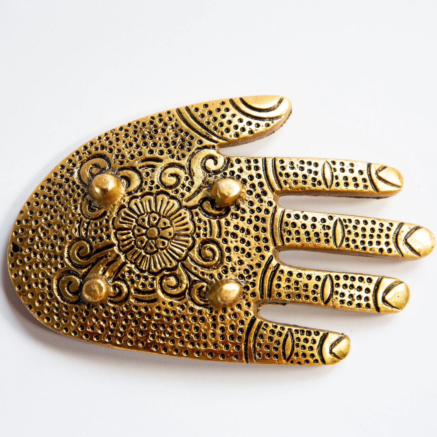 Gold-toned Artschatz hand-shaped incense holder with intricate floral and dotted patterns. - Golden Hand Incense Holder
