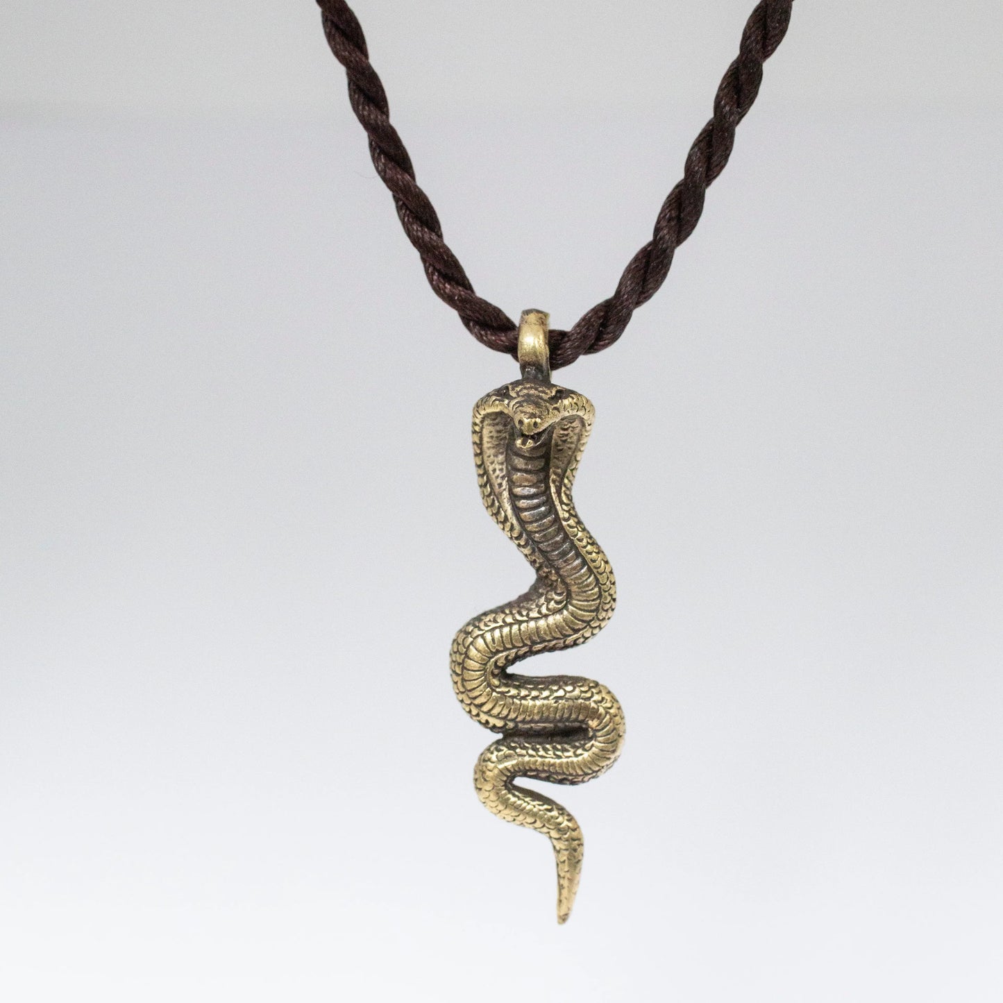 Brass Artschatz snake serpent Naga pendant with detailed scales on twisted dark brown cord necklace. - Snake Serpant Naga Pendant Brass Necklace