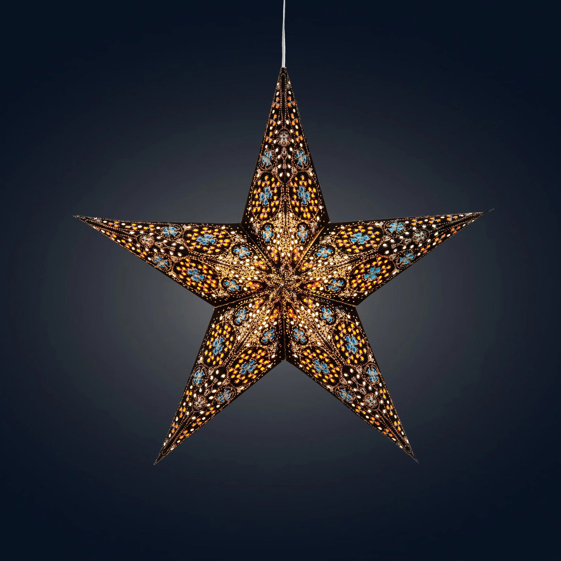 15" black and turquoise Artschatz 5-point paper star lantern with intricate cutouts emitting warm light. - Cathedral 5 Pointer 15" Black/Turquoise