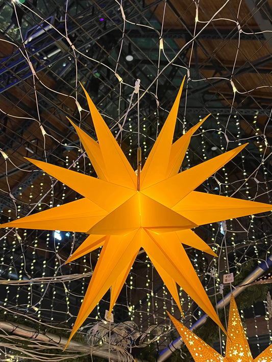 Moravian Star yellow 24-inch paper star light by Artschatz – traditional Moravian form.